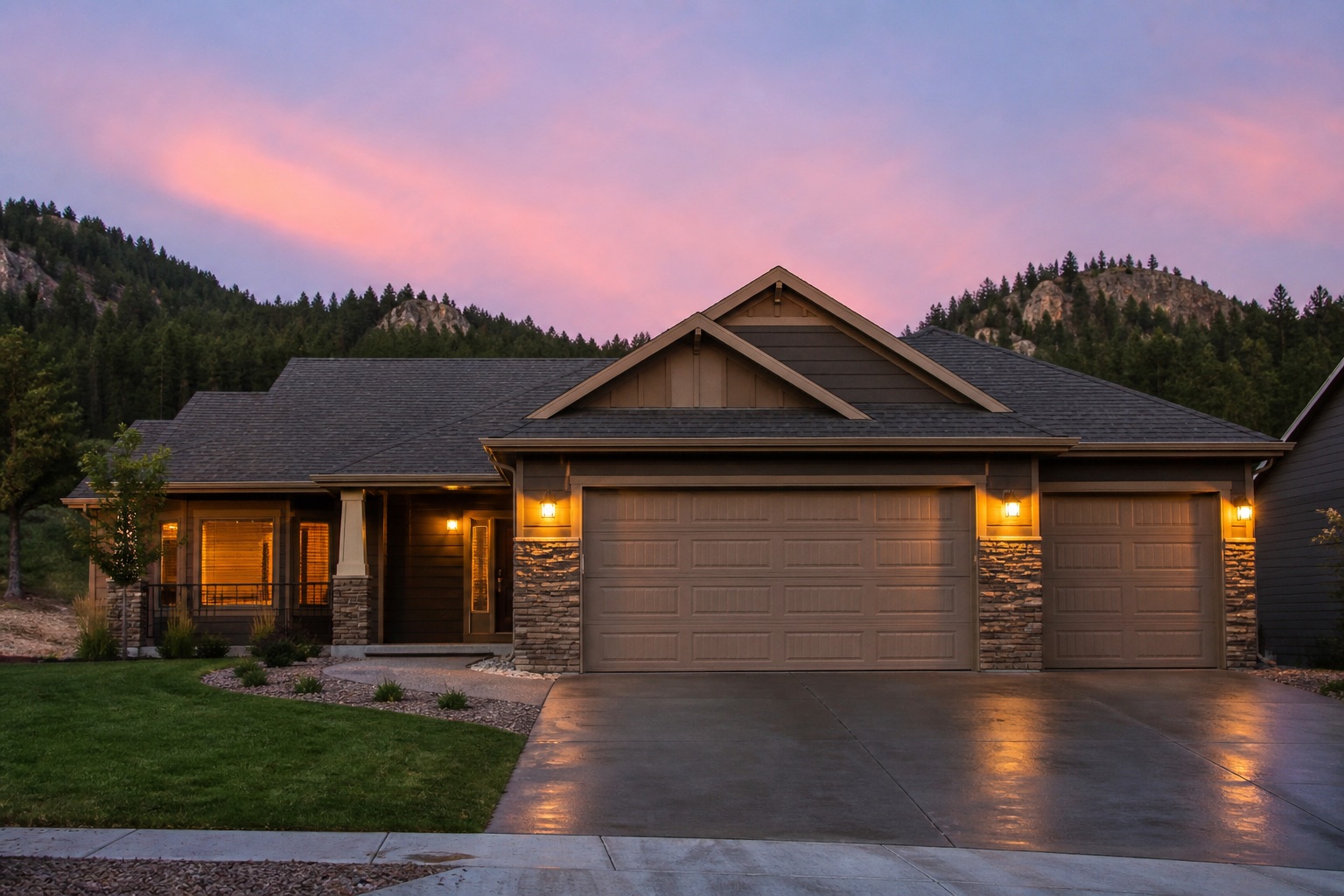 Rapid City area home with garage doors at dusk